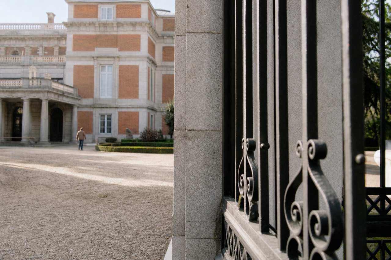 Stone staircase and iron balustrade inside a converted 19th-century Madrid mansion