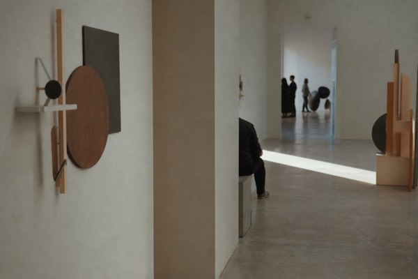 Hands-on exhibit room with a lit column of falling water droplets frozen by strobing light